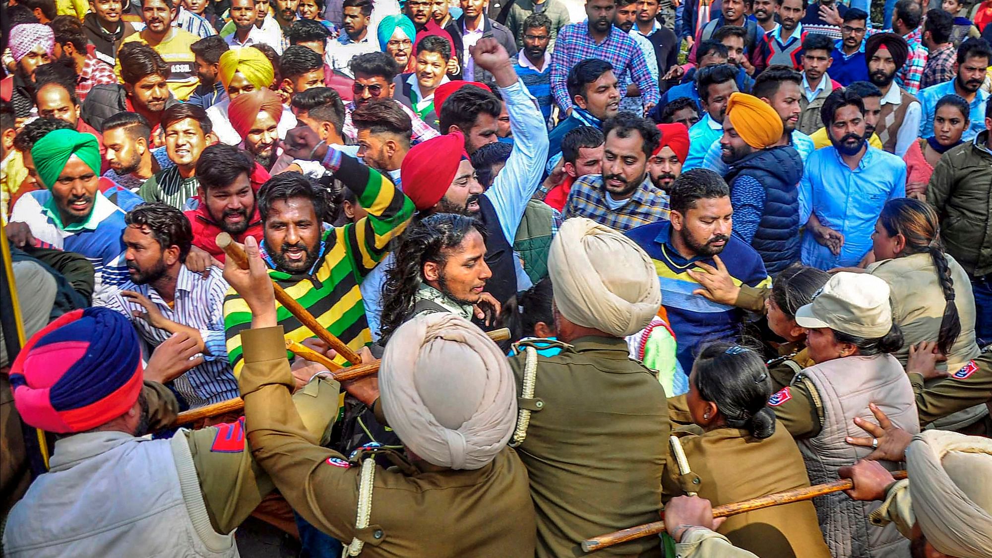 Police lathicharging protesters in Patiala during a march.