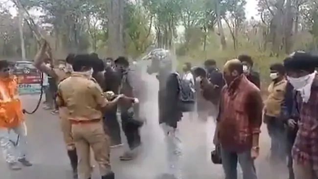 A video surfaced on Twitter where a bunch of bikers were being sprayed on at the Kerala border.