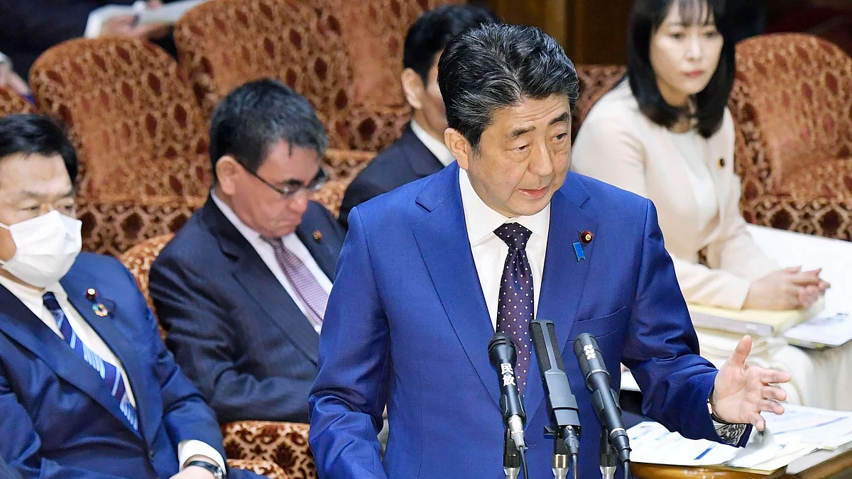 Japan’s Prime Minister Shinzo Abe speaks at a parliamentary session in Tokyo Monday, March 23, 2020. Abe said a postponement of Tokyo Olympics would be unavoidable if the games cannot be held in a complete way because of the coronavirus pandemic. 