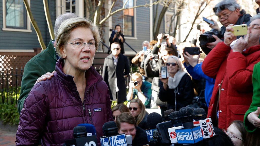 Senator Elizabeth Warren addresses supporters and the media outside her home, Thursday, 5 March, 2020, in Cambridge, after she dropped out of the Democratic presidential race.