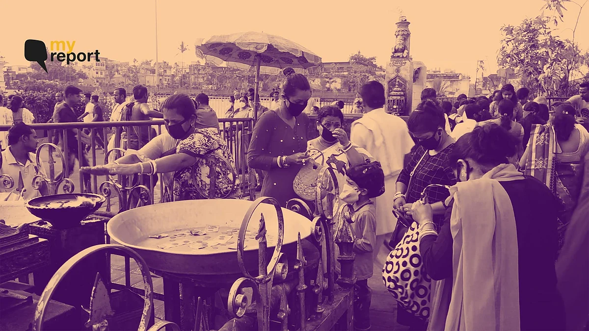 Devotees in Jagannath Temple are visiting with masks on.