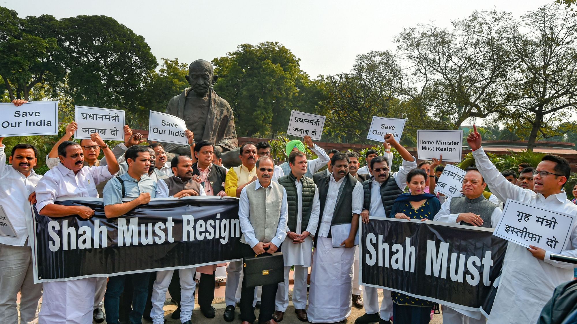 Congress MPs protest in front of Gandhi statue in Parliament