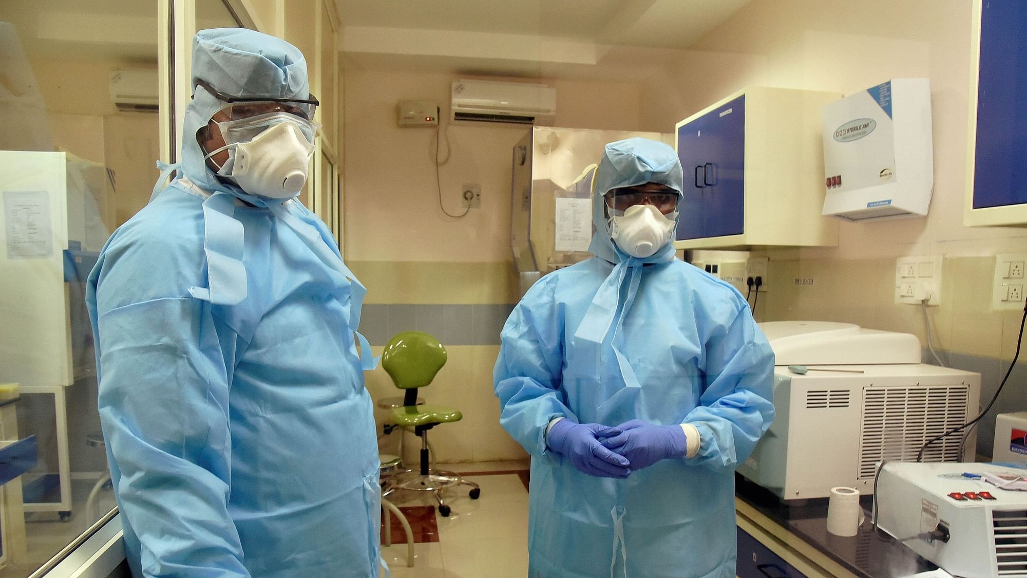 Medics wearing protective suits are seen inside an isolation ward in Vijayawada.&nbsp;