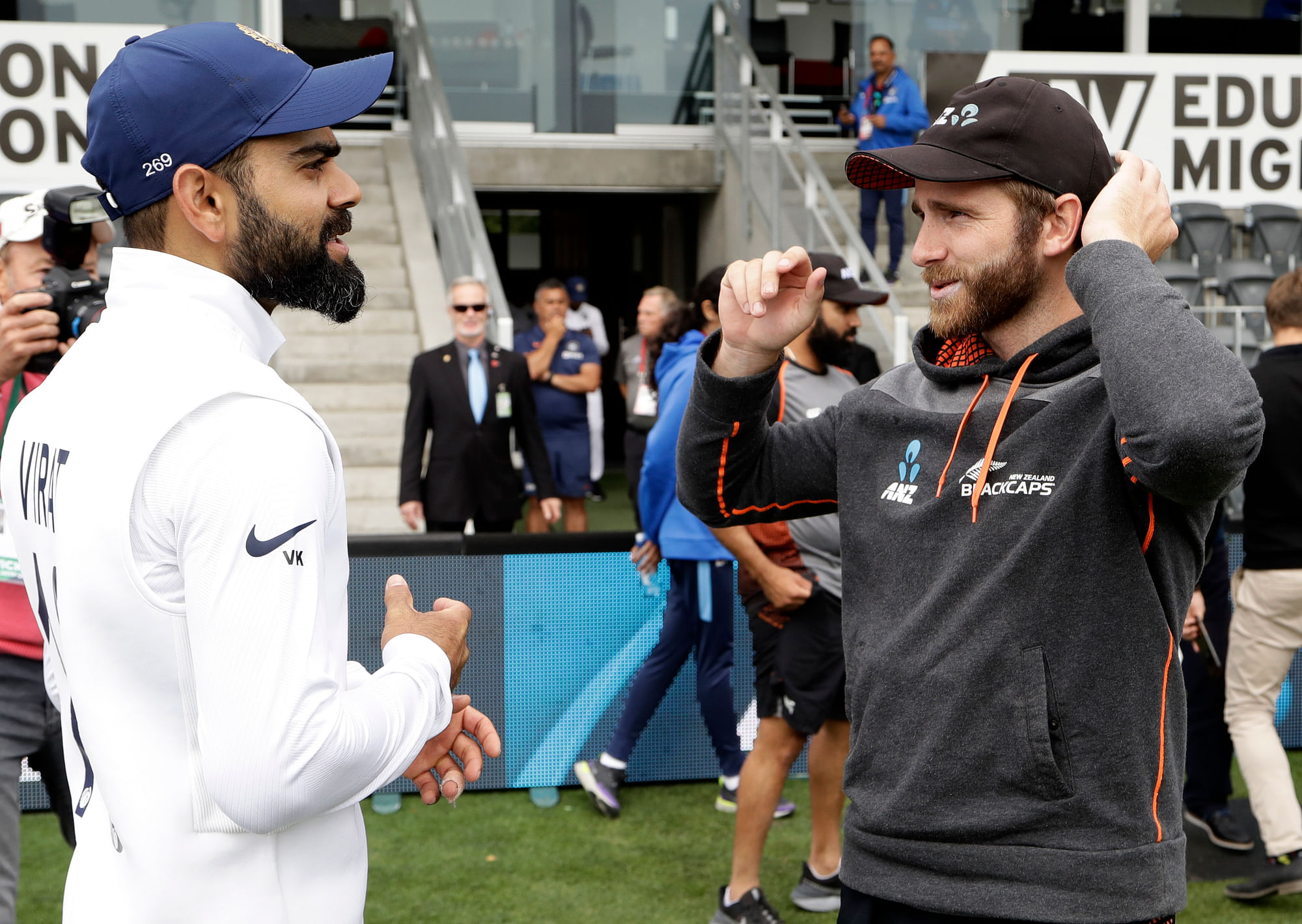 Indian captain Virat Kohli, left, talks with New Zealand captain Kane Williamson following play on day three of the second cricket test between New Zealand and India at Hagley Oval in Christchurch, New Zealand.