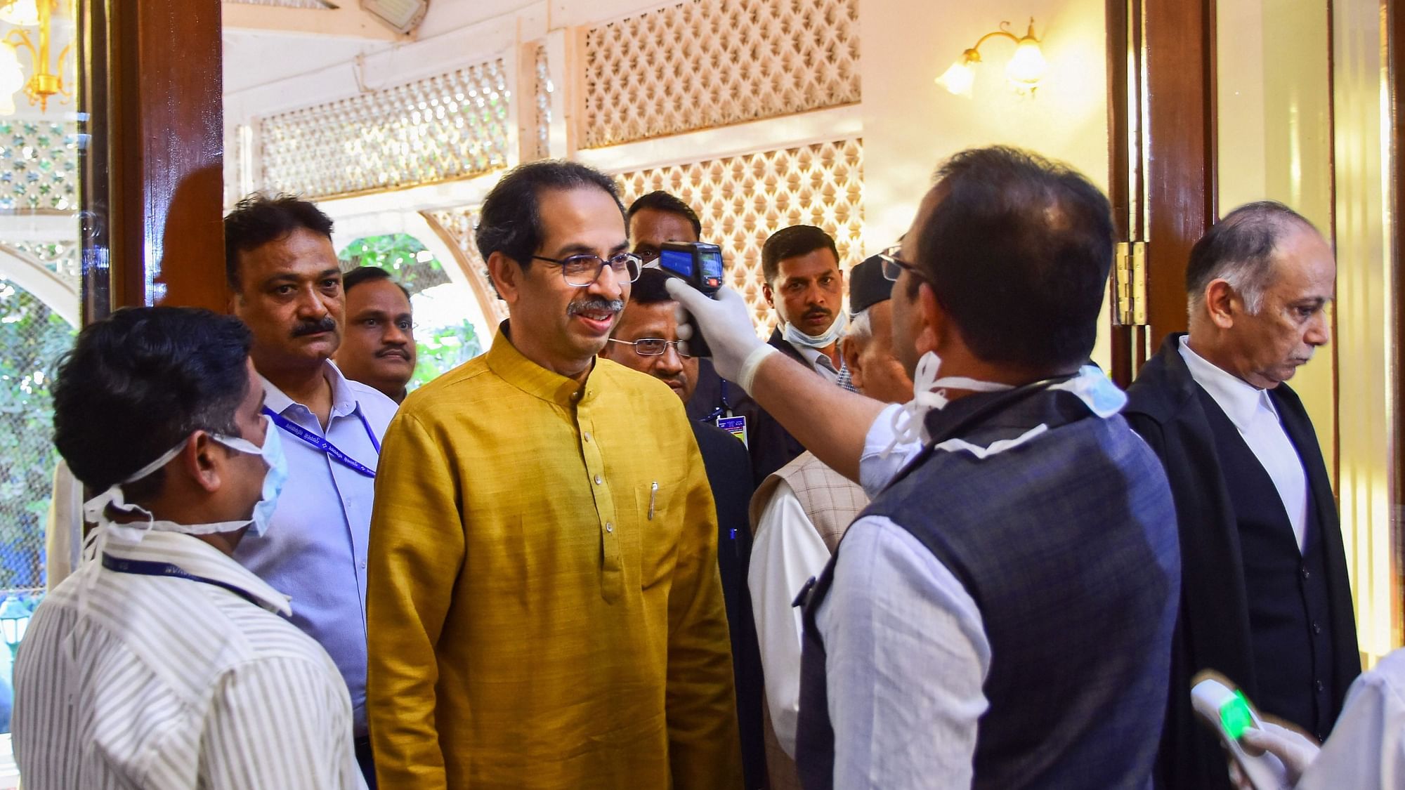 File Image: An official uses a thermal screening device on Maharashtra Chief Minister Uddhav Thackeray, in wake of deadly coronavirus outbreak.