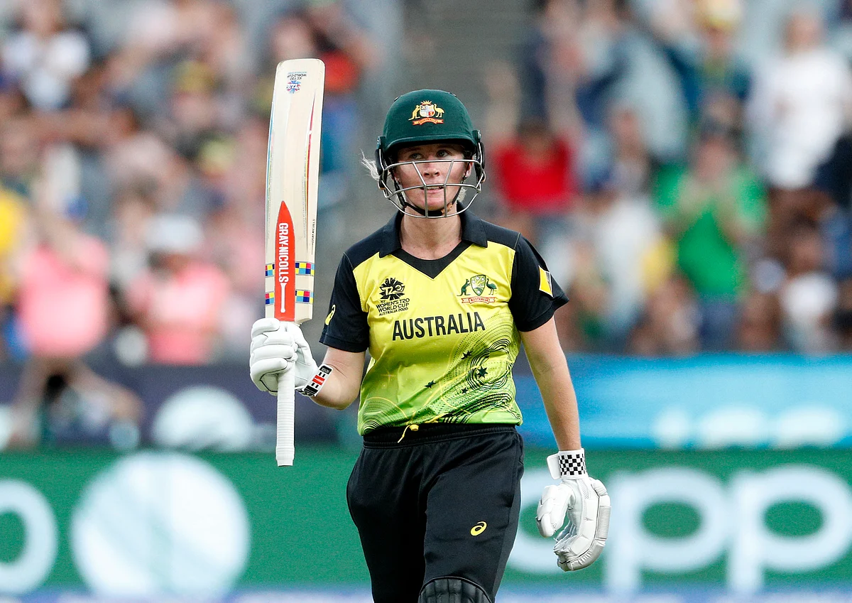 Australia’s Beth Mooney lifts her bat after scoring 50 runs during the Women’s T20 World Cup cricket final match against India in Melbourne.