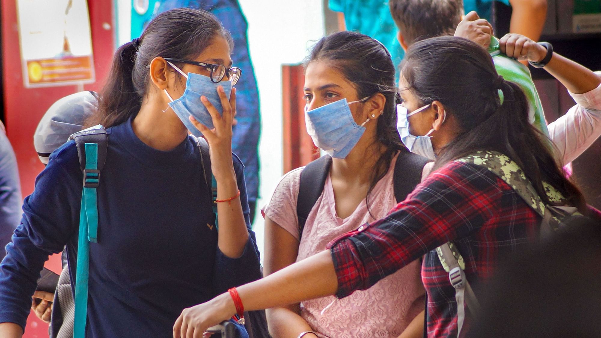 File Image of Passengers wear masks as a preventive measure against novel coronavirus (COVID-19) pandemic, at Bhubaneswar railway station.&nbsp;