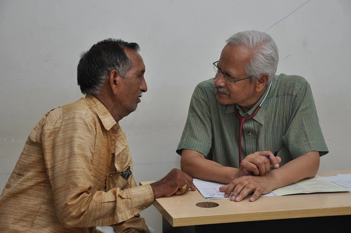 Dr SP Kalantri attends a patient.