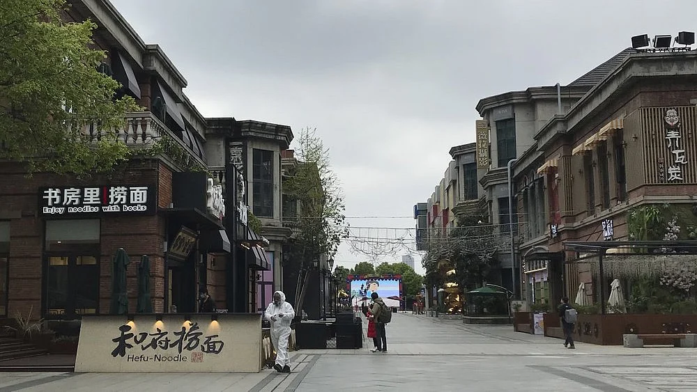 Shopkeepers in the city at the center of China's virus outbreak were reopening on Monday but customers were scarce after authorities lifted more of the anti-virus controls that kept tens of millions of people at home for two months.