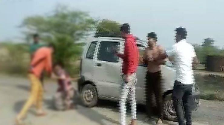 In the video, a group of men can be seen thrashing the victims.