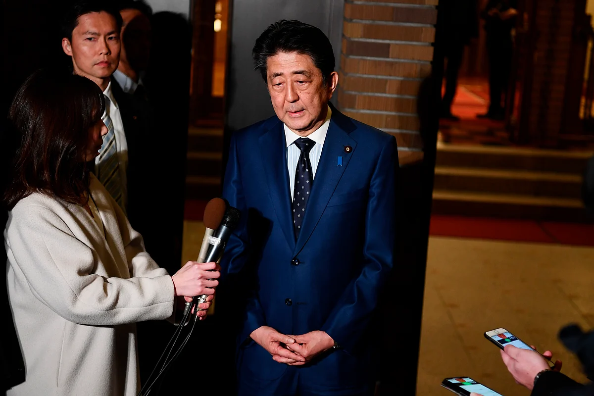 Japan’s Prime Minister Shinzo Abe talks to journalists after making decision to postpone the Tokyo Olympics with the IOC President Thomas Bach, in Tokyo, Tuesday, March 24, 2020. 