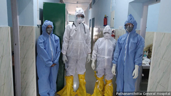 Doctors and staff at the Pathanamthitta General Hospital wearing personal protective equipment.
