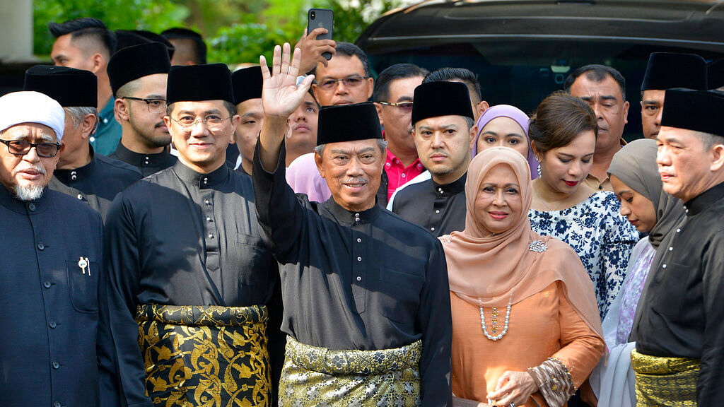 Muhyiddin Yassin (centre), a seasoned politician, was sworn in as the new leader at the palace Sunday.