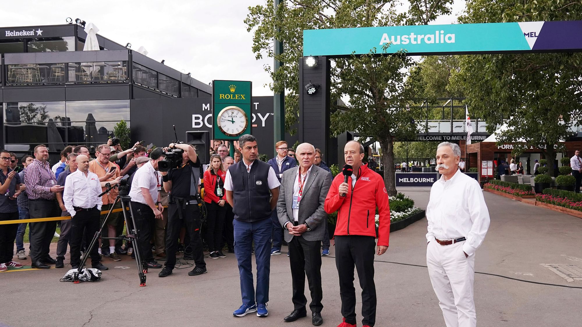 Michael Masi of the FIA, center left, Australian Grand Prix Corporation Chairman Paul Little, Australian Grand Prix Corporation CEO, Andrew Westacott and executive chairman of the Formula One Group Chase Carey speak to media about the cancellation of the Formula 1 Australian Grand Prix 2020.