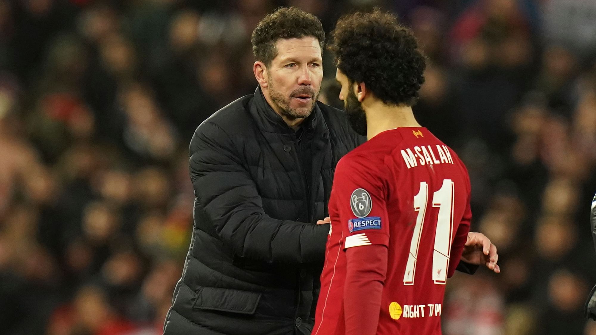 Atletico Madrid coach Diego Simeone with Liverpool’s Mo Salah after their Champions League match in Liverpool on Wednesday.