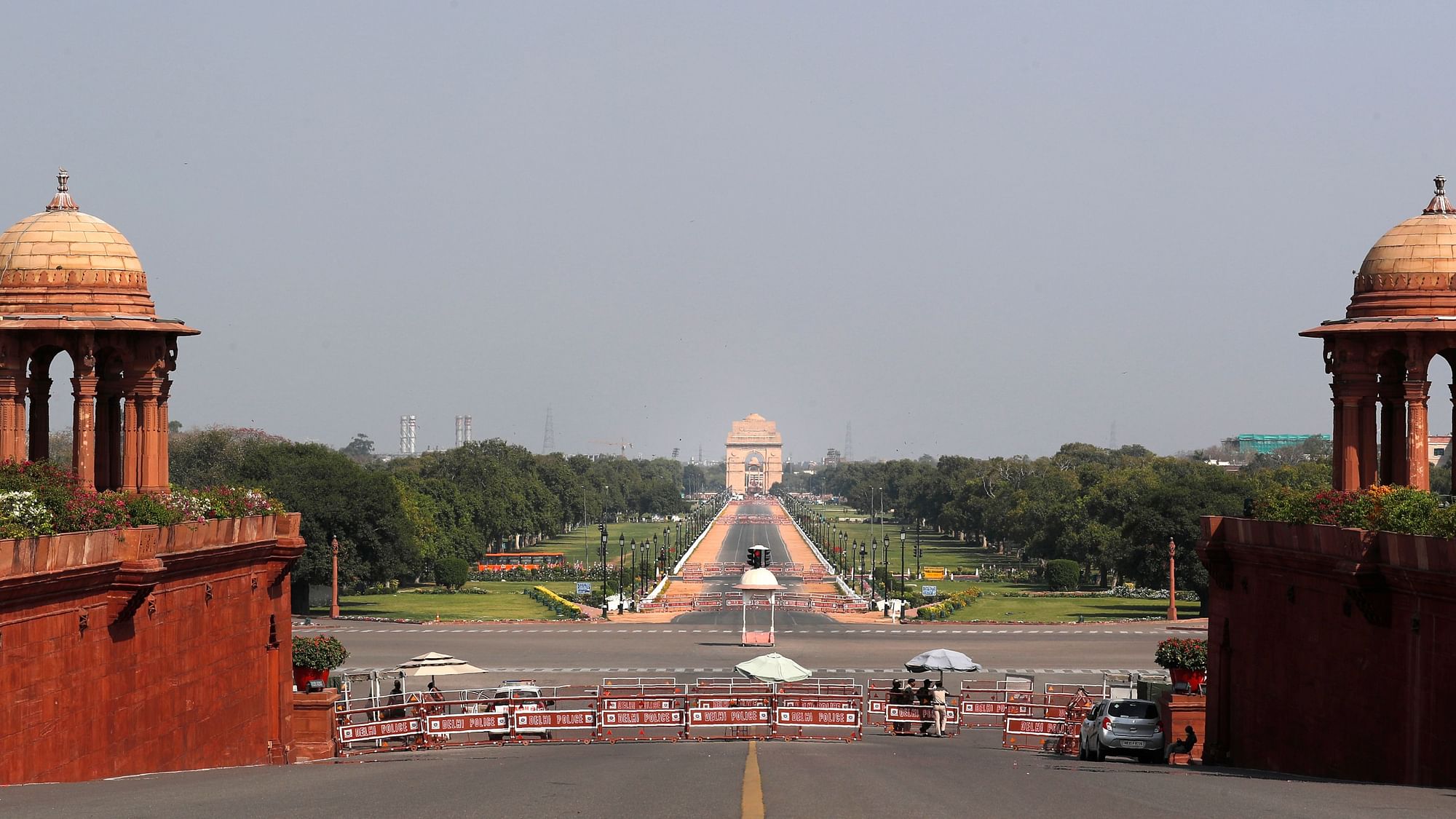 A main road from the Raisina hill leading up to India Gate is seen deserted.