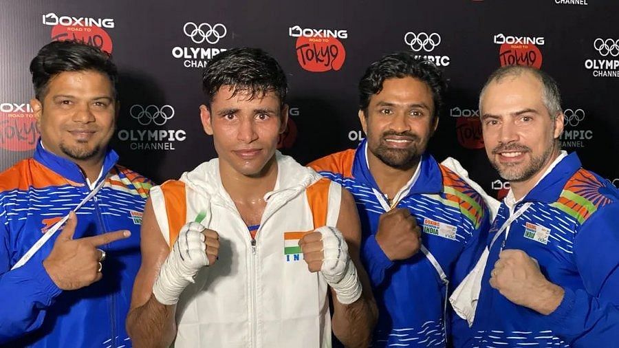 Ashish Kumar (75kg) with his support staff after winning the opening bout of the Asian Olympic qualifiers.