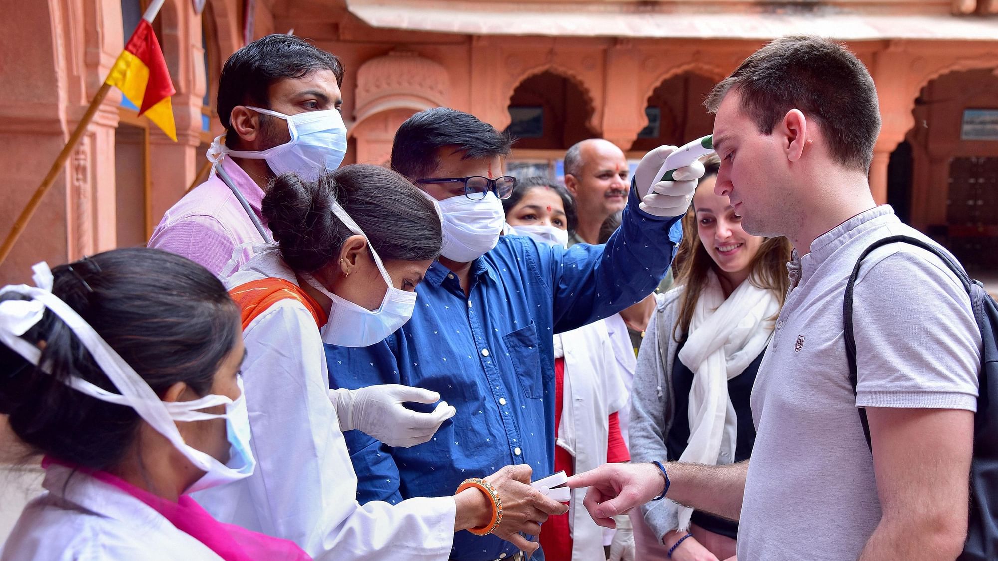 Medical officials check tourists in wake of the deadly coronavirus, at Junagarh fort in Bikaner, Wednesday, March 11, 2020.