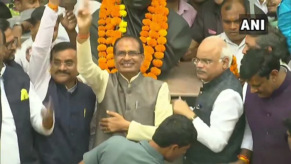 Shivraj Singh Chouhan with BJP members at party office in Bhopal.