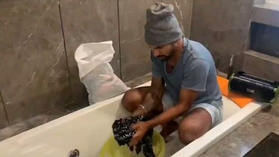 In the funny clip, Shikhar Dhawan can first be seen washing clothes while sitting in a bath-tub. 