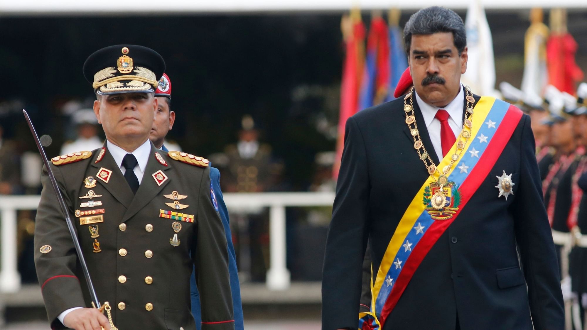 In this 24 May 2018 file photo, Venezuela’s President Nicolas Maduro, right, walks with his Defence Minister Vladimir Padrino Lopez as they review the troops during a military parade at Fort Tiuna in Caracas, Venezuela.