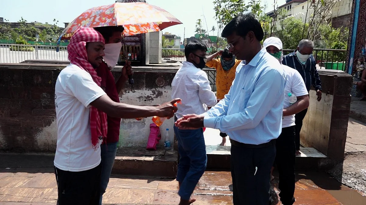 Devotees were asked to sanitise before entering the temple premises. 