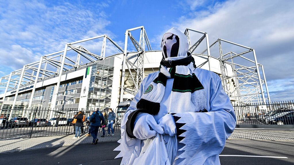 A Borussia fan dressed as ghost stands in front of the stadium prior the German Bundesliga soccer match between Borussia Moenchengladbach and 1 FC Cologne in Moenchengladbach, Germany, Wednesday, 11 March. It is the first Bundesliga match played behind closed doors without spectators due to the coronavirus outbreak.&nbsp;