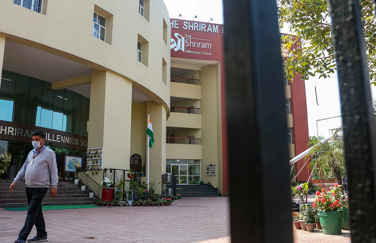 A staff member of Shriram Millennium School leaves the campus as the school closed for two days after a student’s parent tested positive for novel Coronavirus.