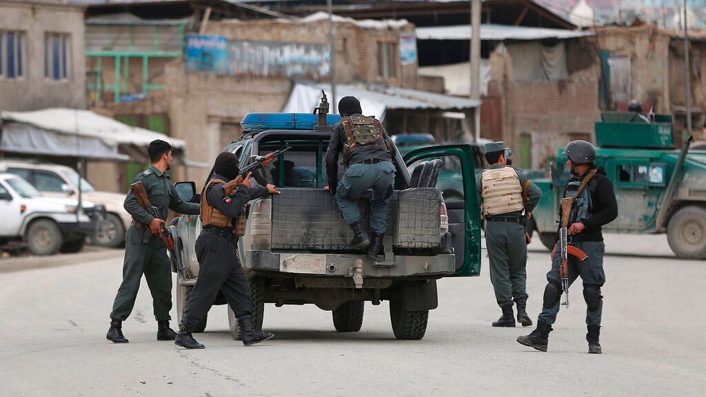 Afghan personnel arrive at the site of an attack in Kabul on 25 March.&nbsp;