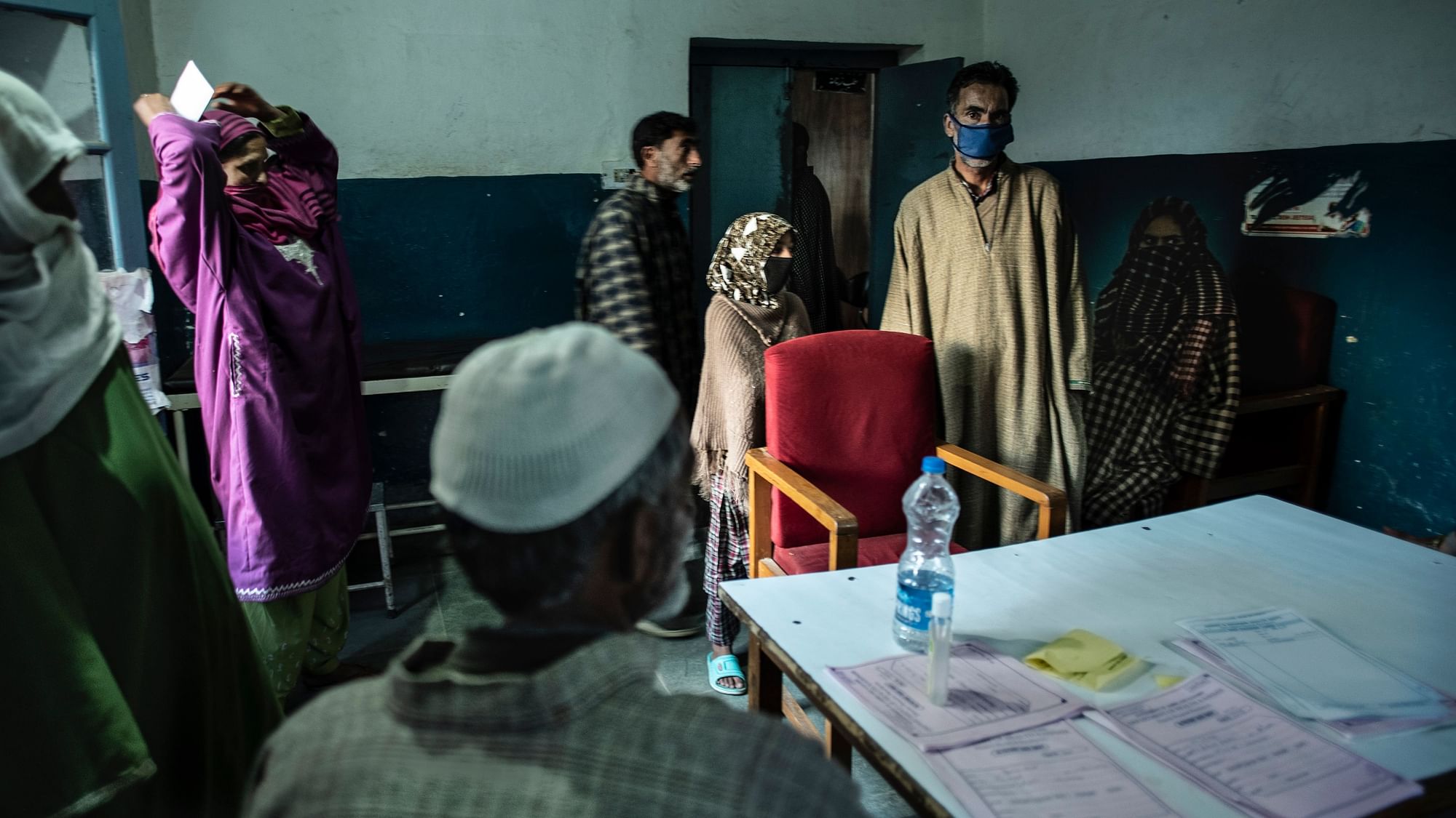 Worried patients inside a doctor’s OPD room at Bandipora Hospital of Northern Kashmir. 