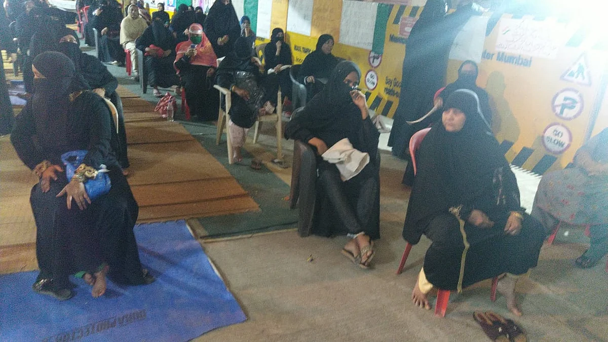 Protesters seen sitting on chairs placed at a distance from each other in Mumbai Bagh.