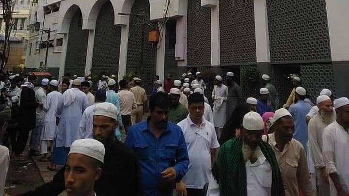 People outside the Tablighi Jamaat Markaz in Nizamuddin<br>