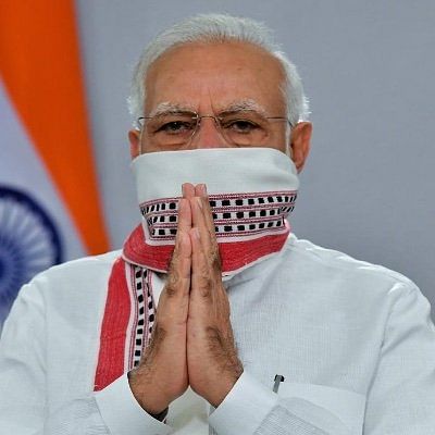 In the new DP, the Prime Minister can be seen using his scarf as a mask. 