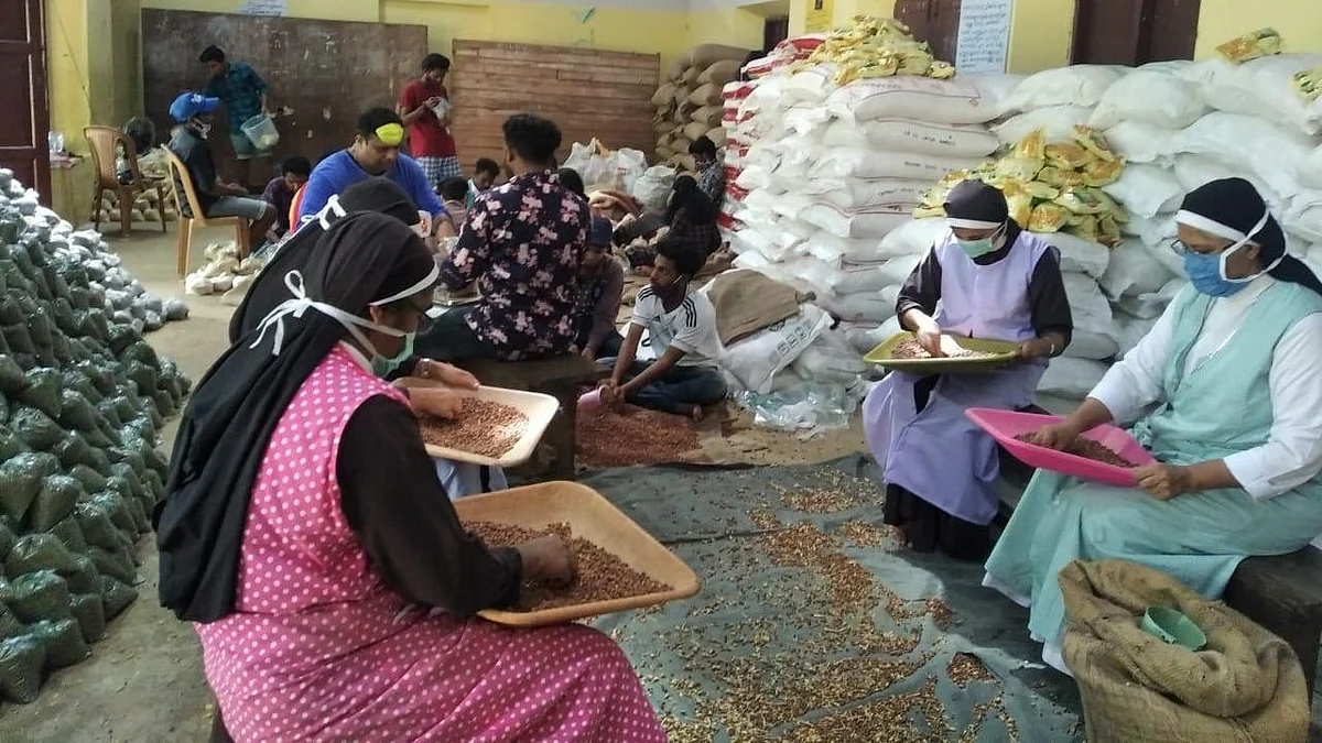 Nuns from Podimattam CMI Convent working on making food kits.