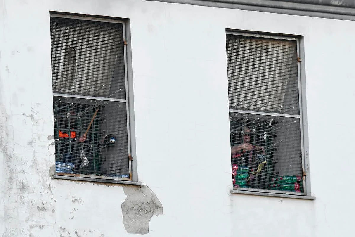 Inmates protest inside Poggioreale prison in Naples on 1 April. <br>