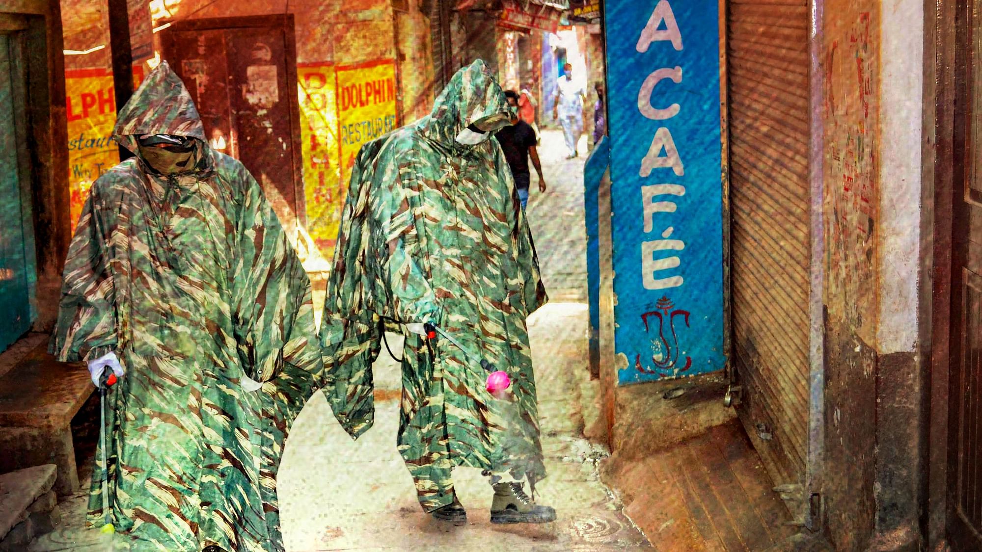 CRPF personnel wearing protective outfits sanitize a street near Dasaswamedh Ghat during ongoing COVID-19 lockdown in Varanasi, Tuesday, 21 April, 2020. Image used for representation.