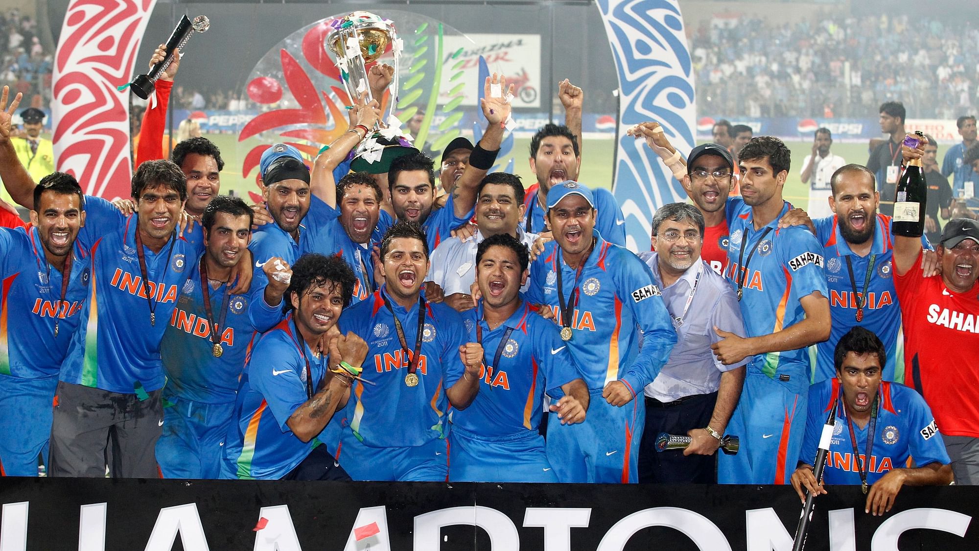 Ashish Nehra with the Indian 2011 World Cup winning team following the win over Sri Lanka in the final in Mumbai.