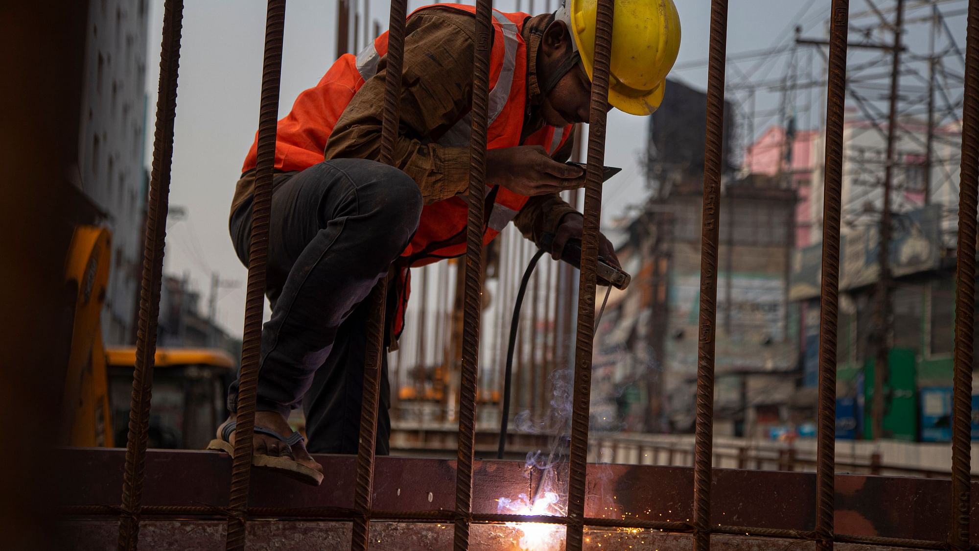 An Indian labourer works on an under construction bridge in Gauhati, India. Image for representation.