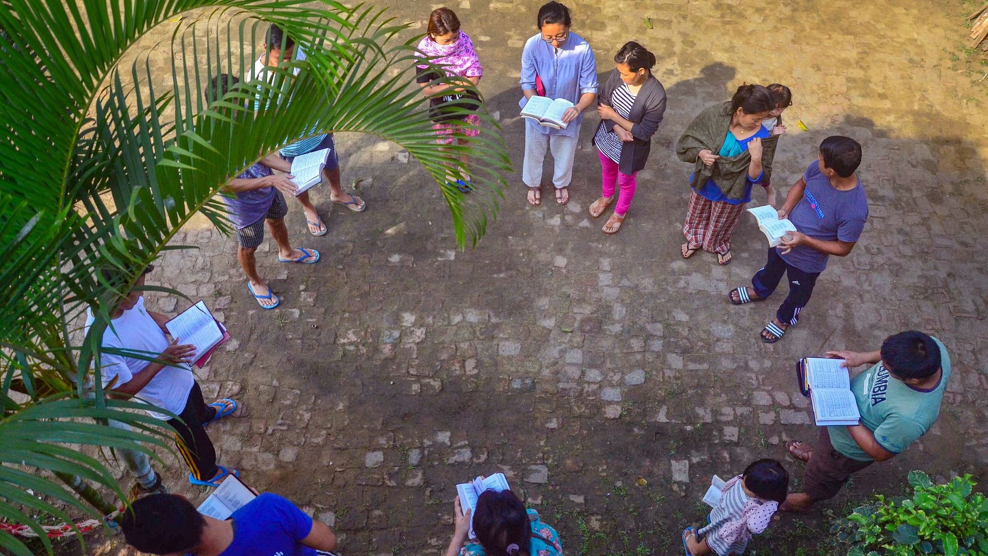 People singing a gospel hymn during a special Easter fellowship outside their house in Dimapur in Nagaland.&nbsp;