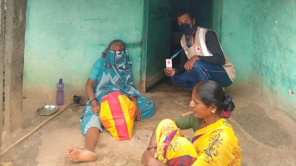 Umesha, with a family he supplied food and rations to.