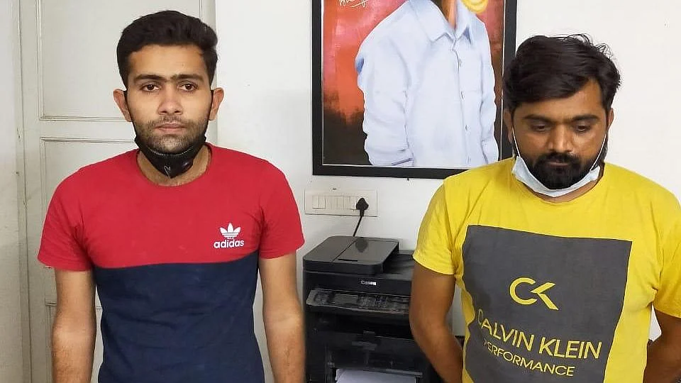 The accused, Hiren (L) and Ravi (R) after their arrest. 