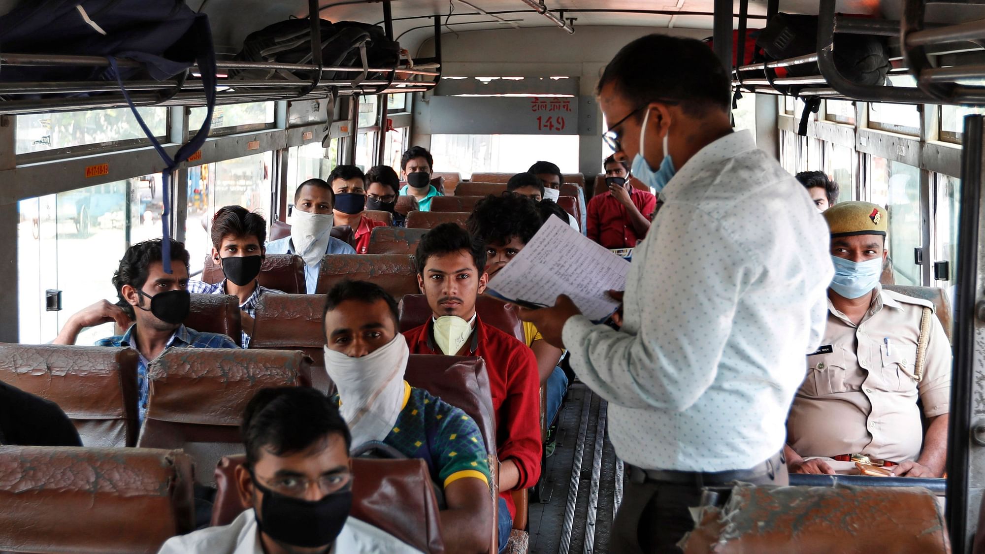 Students who had been stranded in the city for more than a month due to lockdown to prevent the spread of new coronavirus board specially scheduled buses to their respective hometowns in Prayagraj, Tuesday, 28 April 2020.