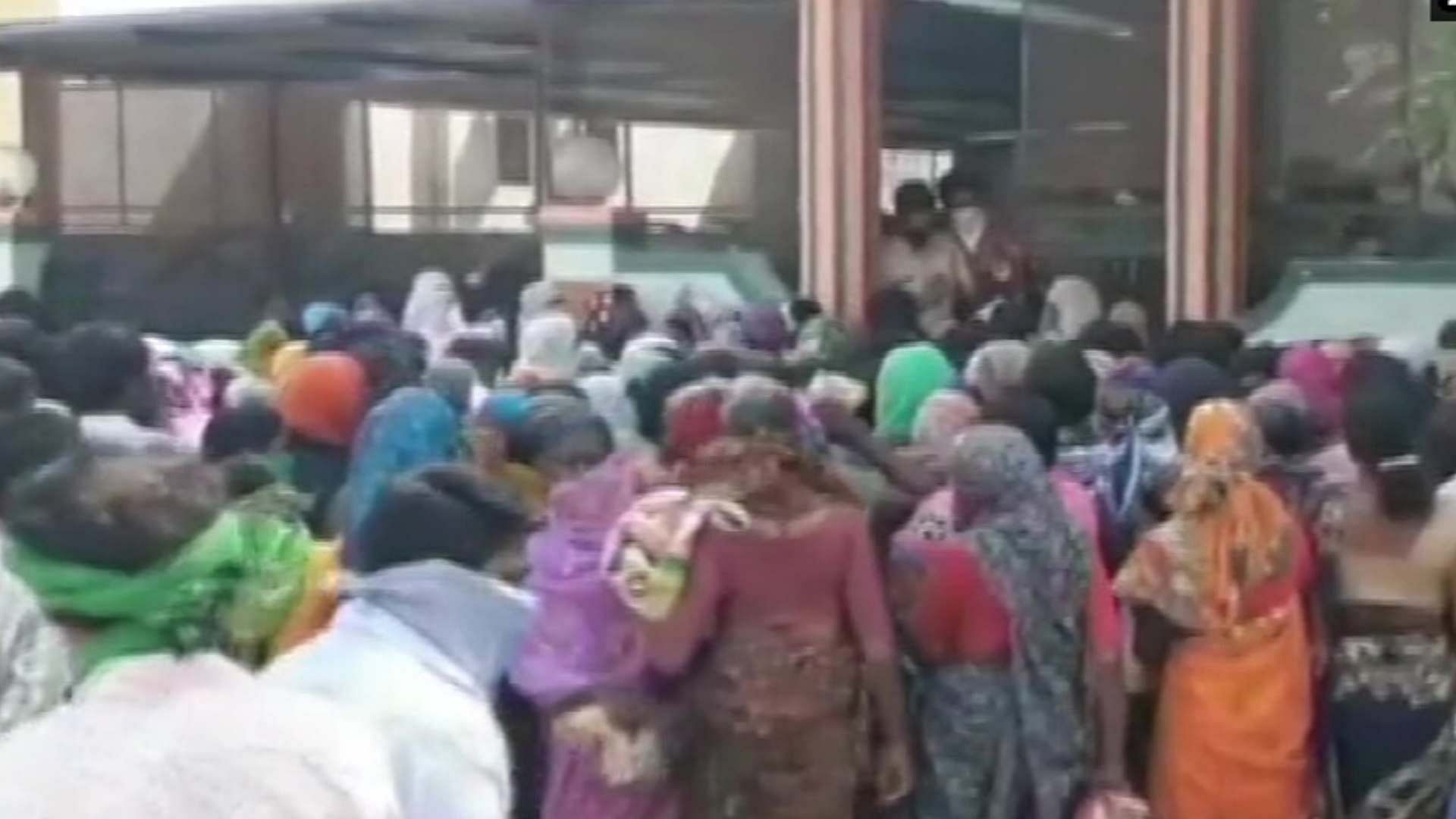 People gather outside an MLA’s house in Maharashtra to collect ration.