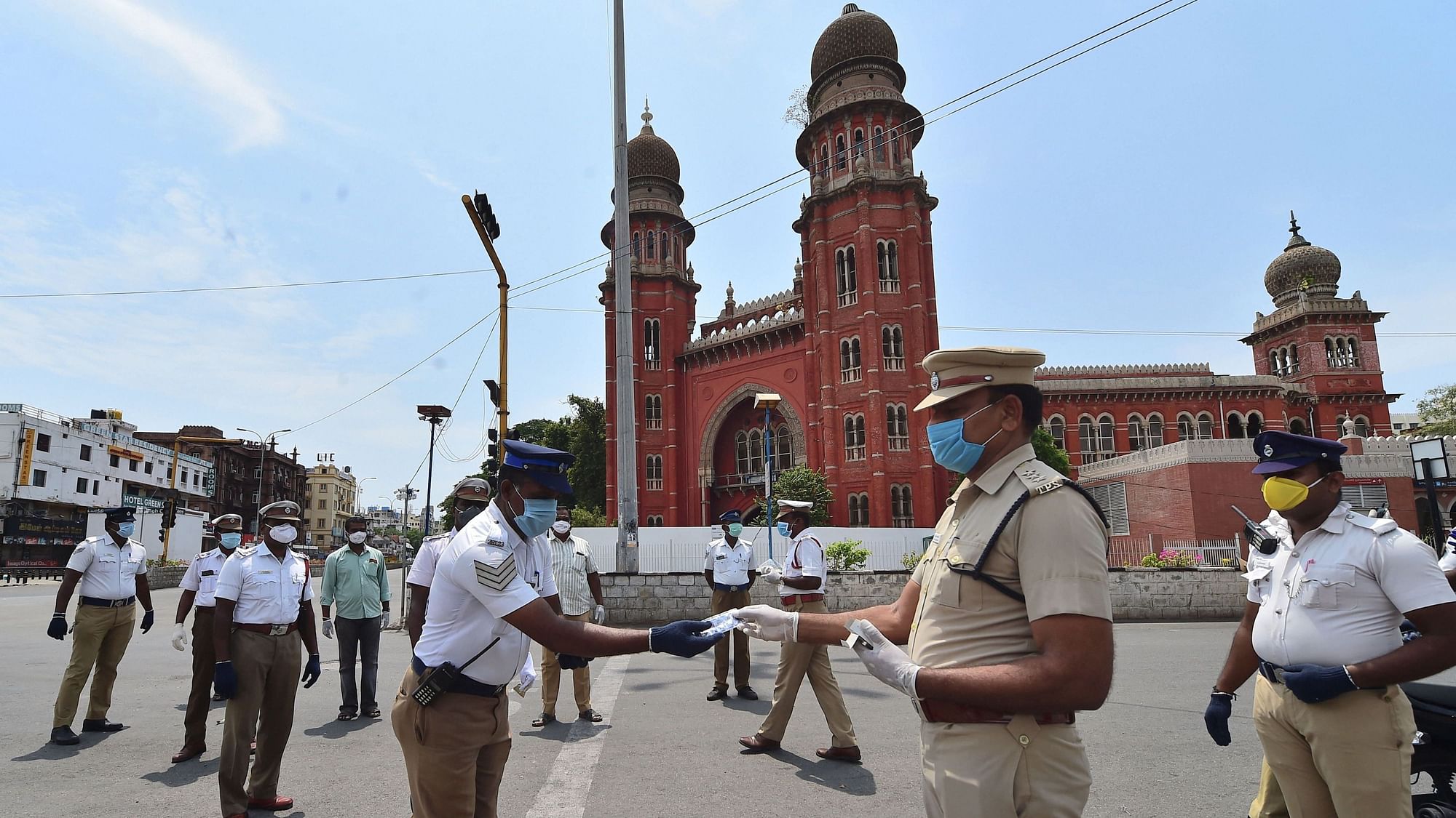 Chennai: Assistant Commissioner of Police (ACP), Traffic, Ravichandran distributes vitamin tablets to his colleagues in a bid to improve immunity against COVID-19 outbreak during the nationwide lockdown, in Chennai, Wednesday, April 29, 2020.