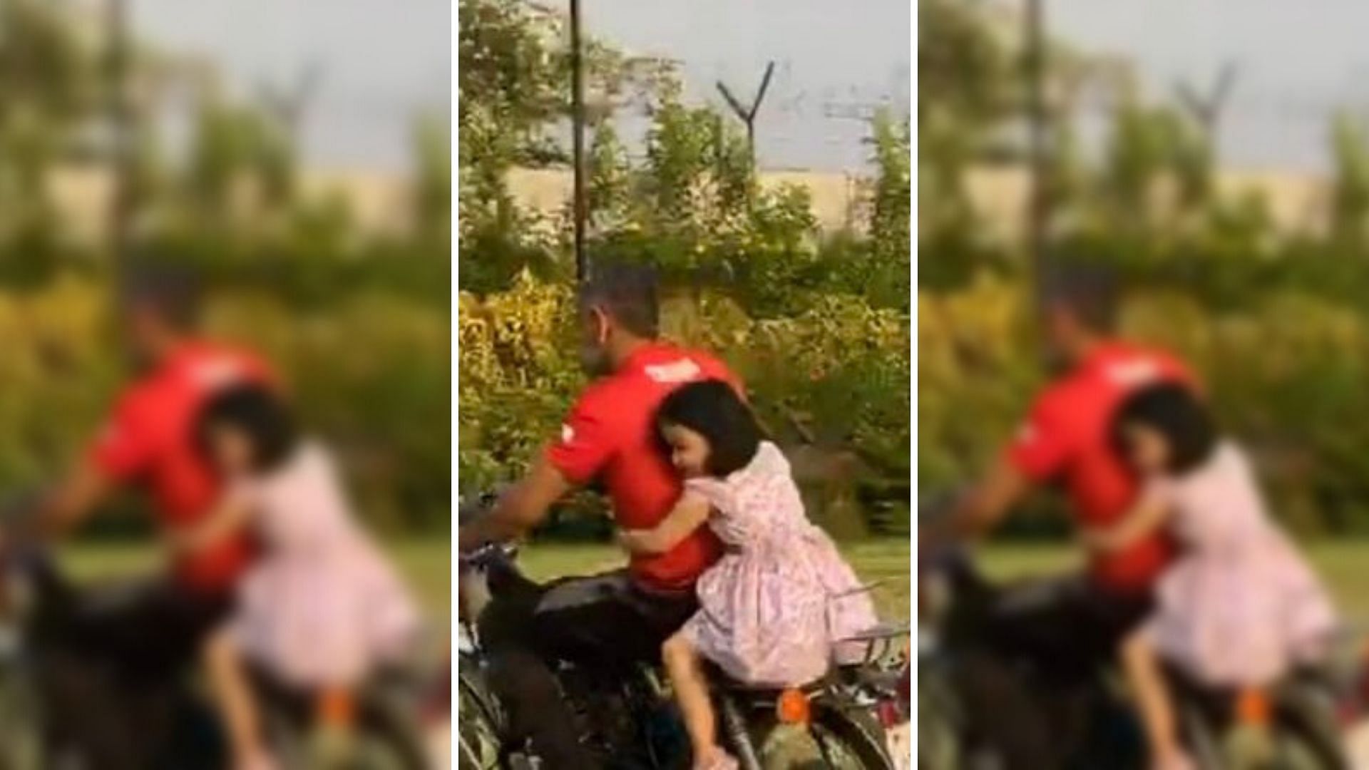 MS Dhoni is seen taking his daughter Ziva on a bike ride around his farmhouse.