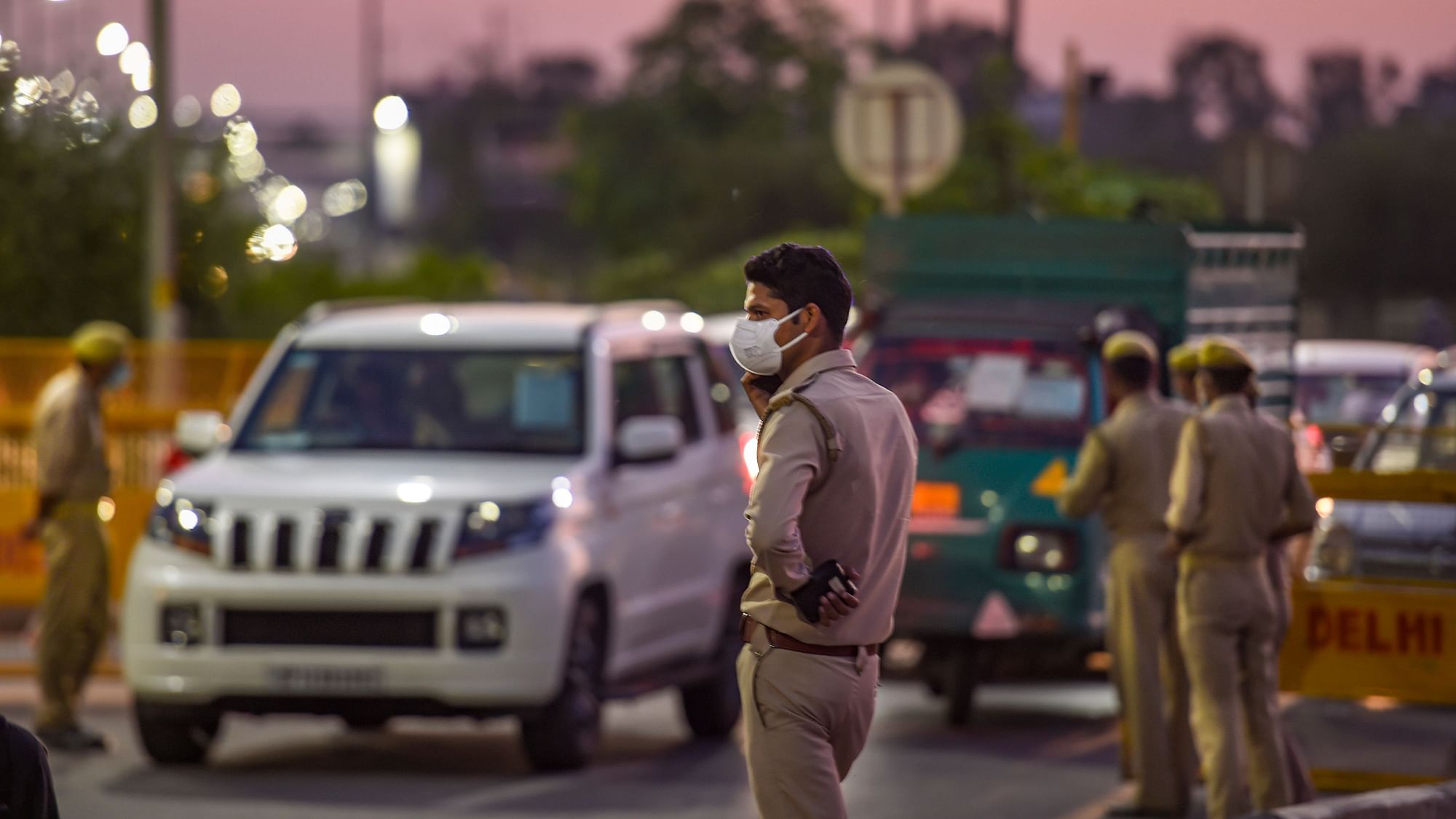 Police stops vehicles at a checkpoint set up on a road at Ghazipur during the nationwide lockdown, imposed in the wake of coronavirus pandemic, in New Delhi, Tuesday, April 21, 2020.