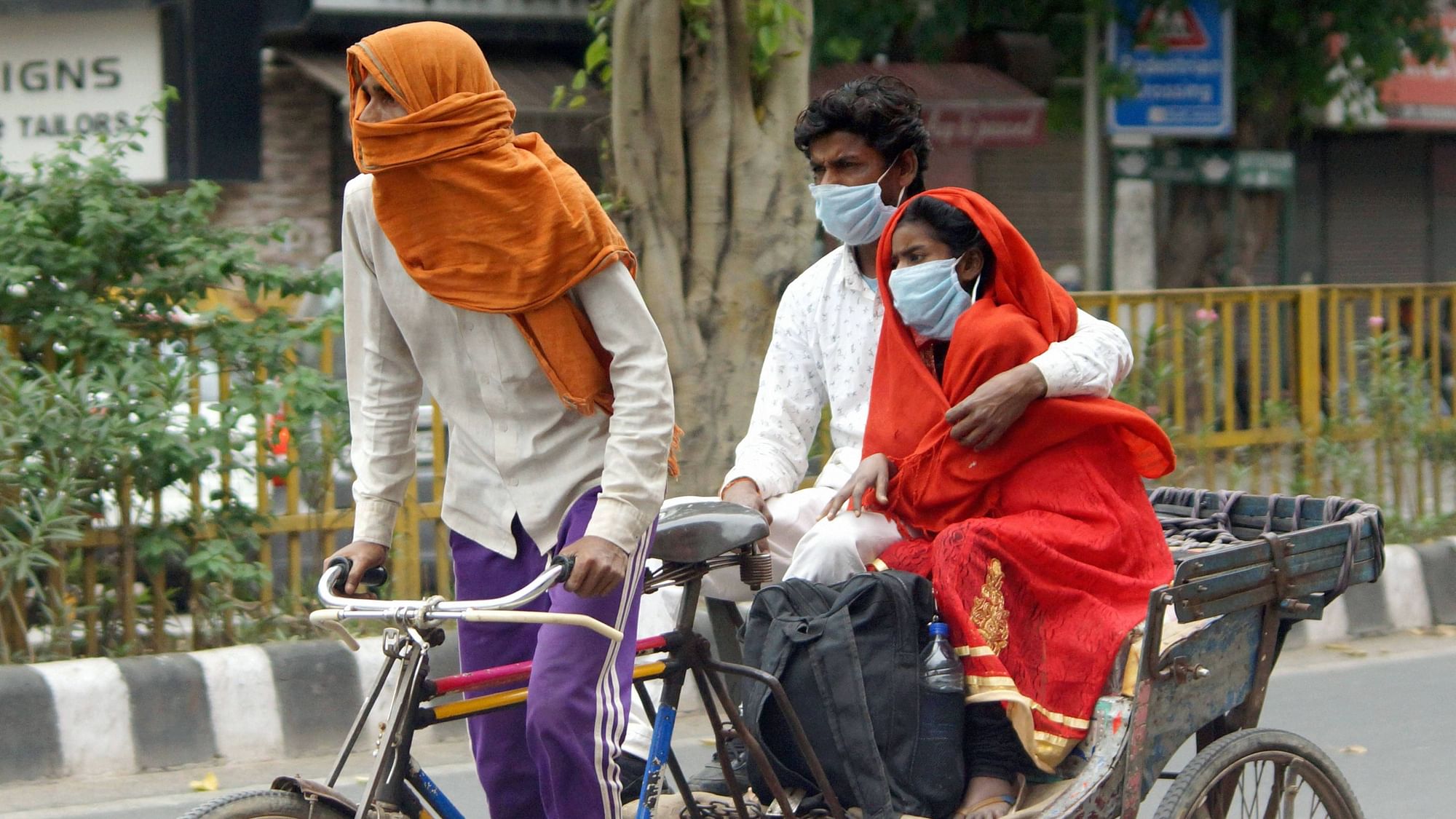 A sick woman being taken to a hospital on a rickshaw, during the lockdown to curb the in Old Delhi, Thursday.