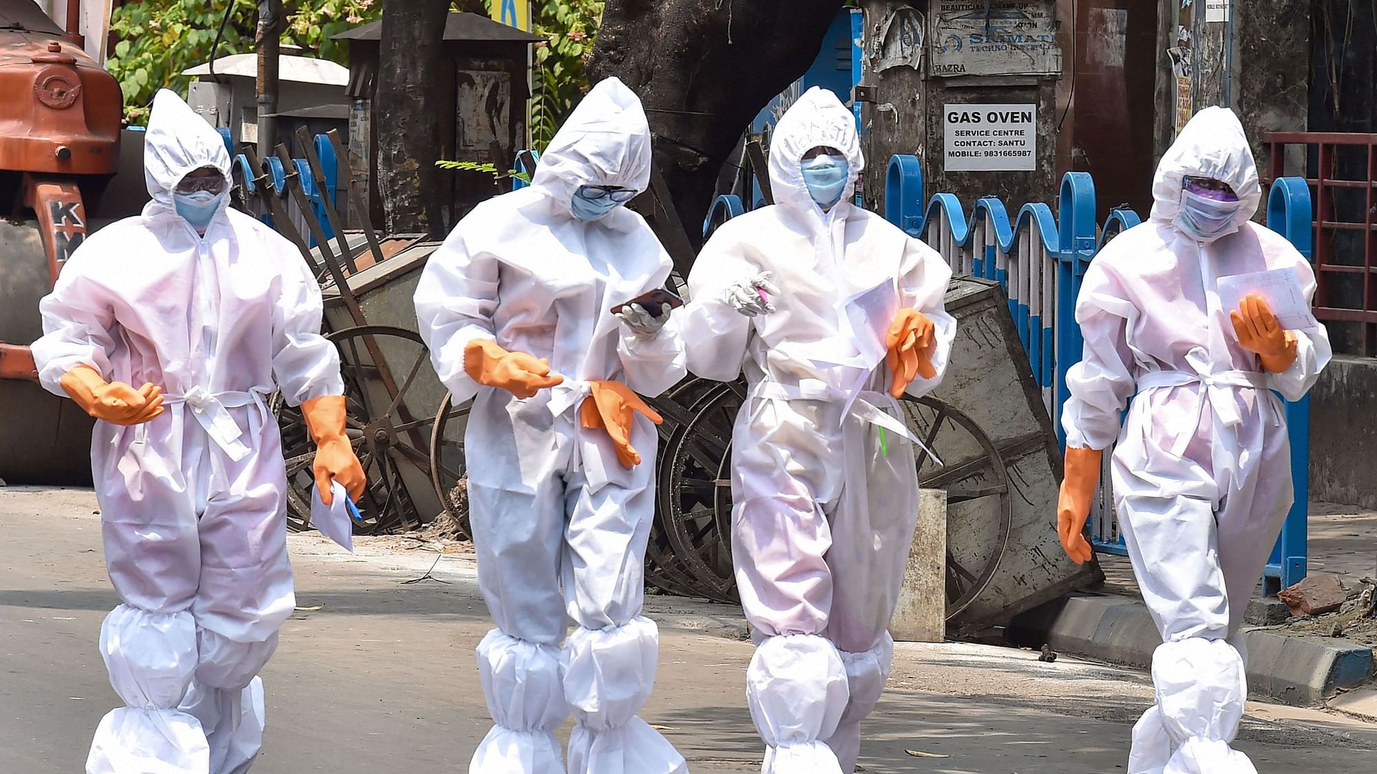 Health workers wearing protective suits walk on a street during their door-to-door survey to detect COVID-19 positive cases in Kolkata (Image for representation).