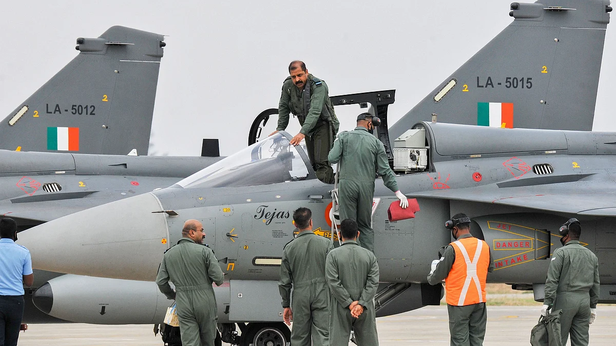 IAF chief RKS Bhadauria prepares to fly Tejas single-seater Light Combat Aircraft (LCA) during its induction ceremony on 27 May.