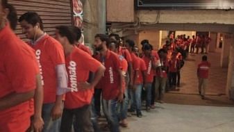 Zomato delivery executives line up.